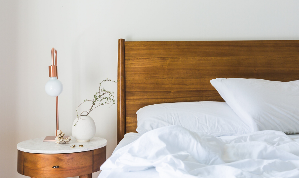 bed with calming lamp and flower