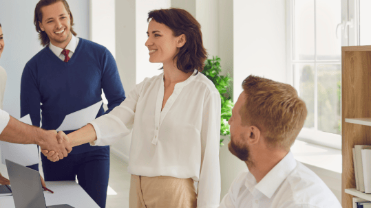 Positive Wellbeing Psychology Melbourne | The Importance of Assertiveness Skills Training and Effective Communication women shaking hands with colleagues