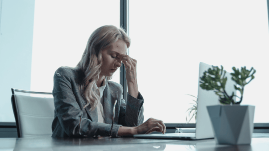 lady at work struggling with stress management