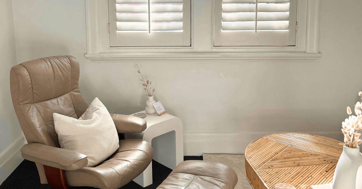 Calm therapy room with a comfortable chair at Positive Wellbeing Psychology Melbourne used for psychiatric assessment, ADHD support, and mental health care.