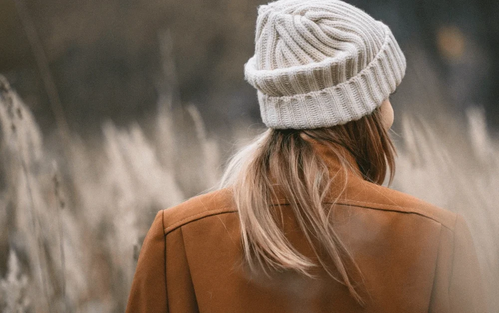 Adult woman looking ahead thoughtfully, representing planning and self-understanding in ADHD therapy Melbourne for adults, including neurodiverse and gender-inclusive care